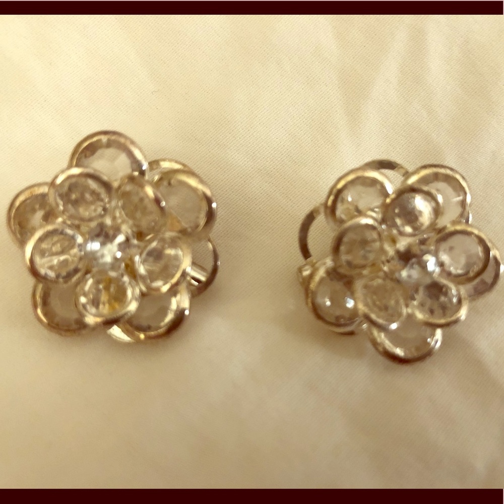 Flower pins with white stones.